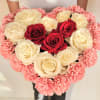 Heart-shaped bouquet of red and white roses edged with pink carnations