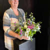 Soft Spring pastels and airy, garden-style movement make this floral arrangement the