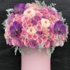 Pink and purple rose bouquet with orchids in a pink box