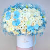 White rose bouquet with blue orchids and a blue ribbon in a white box
