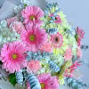 Bouquet of pink and pale yellow gerbera daisies with white blooms