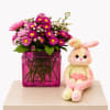 A charming floral arrangement in a stylish ceramic vase, paired with an