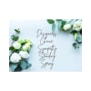 White roses and eucalyptus frame a sympathy spray sign