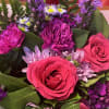 Bouquet of hot pink roses and purple chrysanthemums with small daisy flowers
