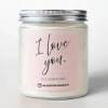 Pink candle in a glass jar with a metal lid and "I love you" label