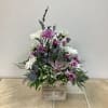 This floral arrangement has a rustic, natural charm with a soothing lavender-inspired