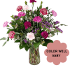 Mixed pink and purple carnations in a glass vase