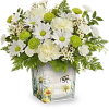 White daisies and green pompons in a painted ceramic vase