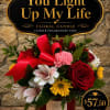 A bold, romantic floral candle arrangement designed to make someone feel truly