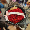 Bouquet of red roses with a gold crown and pink ribbon
