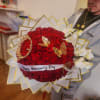 Large bouquet of red roses with white orchids and gold butterfly accents