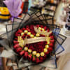 Bouquet of red roses with gold chocolates and a birthday ribbon