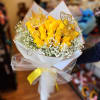 Yellow rose bouquet with baby’s breath and gold butterfly accents