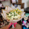 Bouquet of white roses with a gold "Happy Birthday" topper