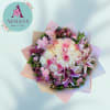 Pink and white rose bouquet with lilies and pastel wrapping