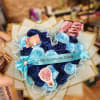 Bouquet of blue roses with a turquoise ribbon and small decorative cards
