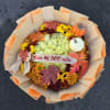 Fall bouquet of yellow and orange flowers with pumpkin decorations