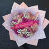 Pink and cream rose bouquet with butterfly decorations and a Valentine ribbon