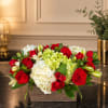 Red roses and white hydrangeas in a rectangular wooden container