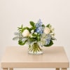 A soft blend of white and blue flowers, thoughtfully designed to create