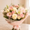 Grace is a tender, pastel dream- featuring creamy white lilies, blush roses