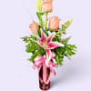 This beautiful vase filled with roses and lily's will surely make mom
