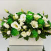 White and bright green roses arranged in a rectangular box