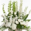 White floral arrangement with tall green and white spikes in a rectangular container