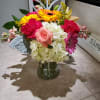 Colorful mixed bouquet in a clear glass vase