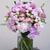 Pink and lavender bouquet in a clear glass vase