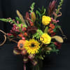 Bright flower bouquet full of fall flowers. Sunflowers, lily buds about to