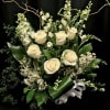 Striking and elegant all white bouquet is appropriate for sympathy and renewal.

Order