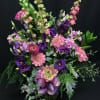 Purple and pink mixed bouquet with eucalyptus in a vase