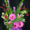 Lush and bold fun flowers in a long lasting assortment. Flowers will