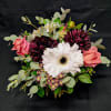 Perfect for an anniversary. Round centerpiece posey of flowers including roses and