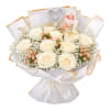 White rose bouquet with baby’s breath, pink berries, and silver heart topper