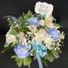 Welcome a new bright-eyed baby boy into the world with this blue