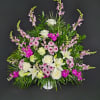 White lilies and roses with pink flowers in a white vase