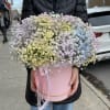 Large pastel bouquet of baby's breath in a pink hat box