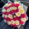 Bouquet of pink and cream roses with a butterfly decoration
