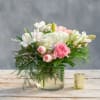 Pink and white mixed bouquet in a glass vase