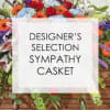 Sympathy casket spray with mixed colorful flowers
