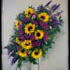 Bring comfort with this bright mix of sunflowers and daisies. 