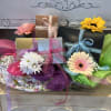 A beautiful, decorated gift basket filled with boxes of assorted Truffles