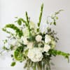 White and green wedding bouquet with roses, orchids, and hydrangeas