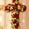 Large cross-shaped floral arrangement of red and pale yellow roses