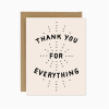 Thank you greeting card with black text on a cream front and brown envelope