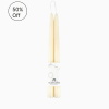 Pair of cream taper candles wrapped together with a Bluecorn Beeswax label