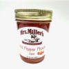 Jar of Mrs. Miller's hot pepper peach jam with a gold lid