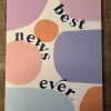 Greeting card with abstract pastel shapes and the phrase “best news ever”.
